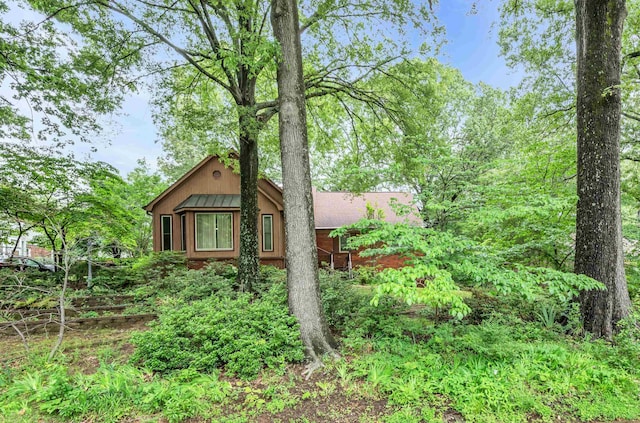 6196 Ivanhoe Cv, Bartlett, TN 38134 - view of side of property featuring a standing seam roof