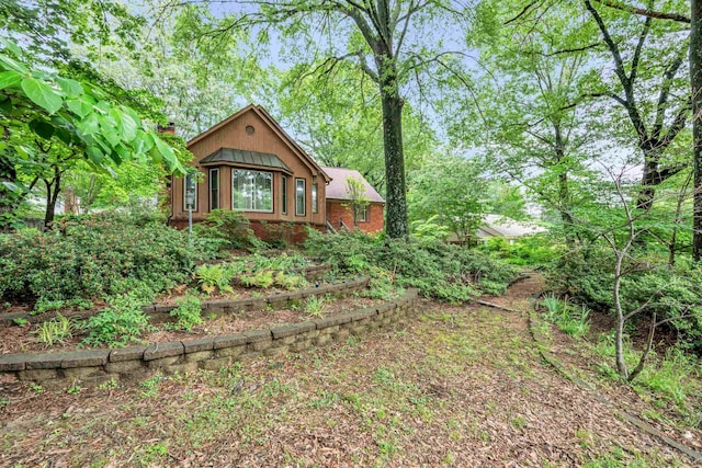 6196 Ivanhoe Cv, Bartlett, TN 38134 - view of front of home with a chimney and brick siding