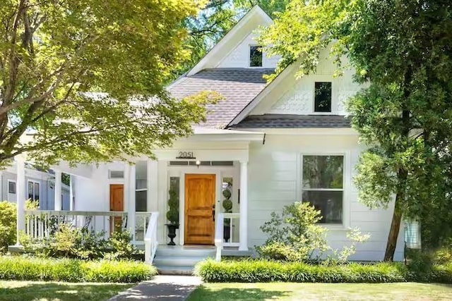 2051 Oliver Ave, Memphis, TN 38104 - view of front of property with roof with shingles and covered porch