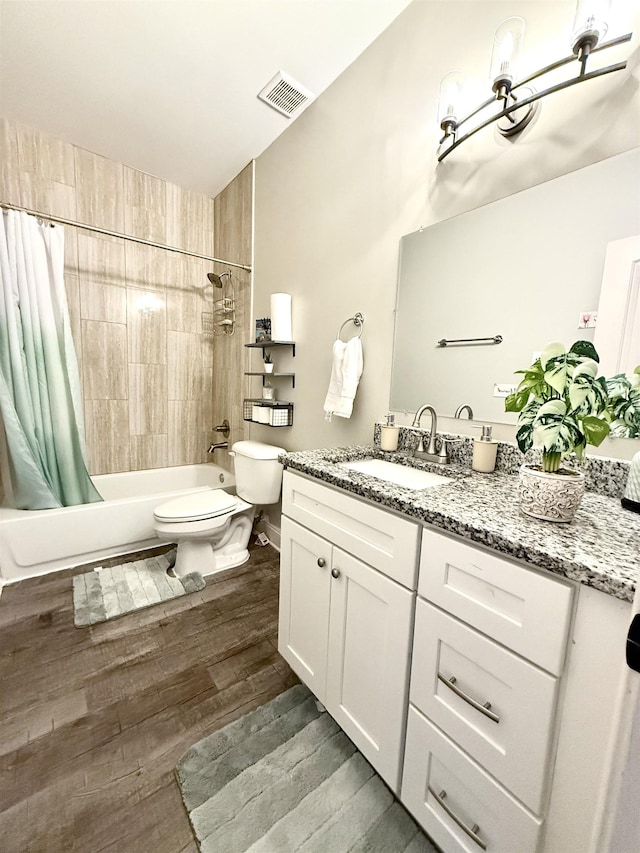 1210 Sanbyrn Dr, Cordova, TN 38018 - full bathroom featuring shower / tub combo with curtain, toilet, wood finished floors, and vanity