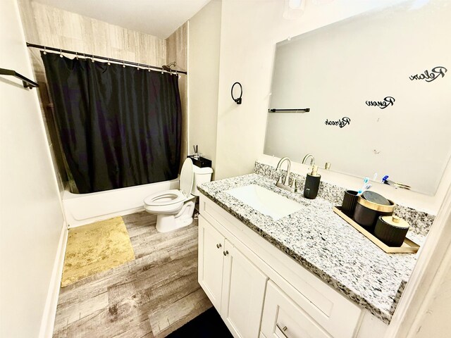 1210 Sanbyrn Dr, Cordova, TN 38018 - full bathroom featuring wood finished floors, vanity, toilet, and shower / bath combo