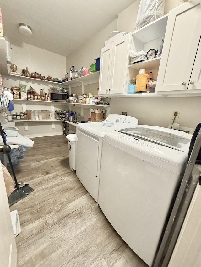 1210 Sanbyrn Dr, Cordova, TN 38018 - washroom featuring cabinet space, washing machine and clothes dryer, and light wood finished floors