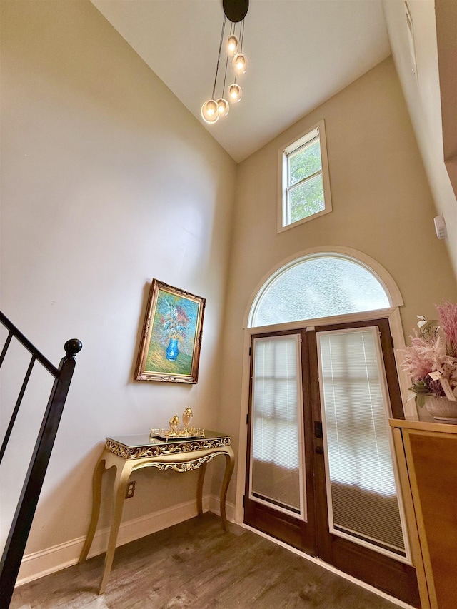 1210 Sanbyrn Dr, Cordova, TN 38018 - entryway featuring wood finished floors, high vaulted ceiling, baseboards, and stairway