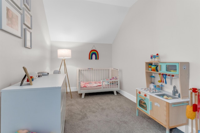 185 Alexander St, Memphis, TN 38111 - bedroom featuring a crib, light colored carpet, lofted ceiling, and baseboards