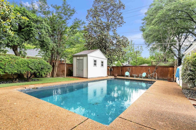185 Alexander St, Memphis, TN 38111 - view of swimming pool with an outbuilding, a fenced backyard, and a shed