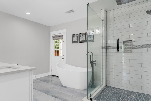 185 Alexander St, Memphis, TN 38111 - full bath featuring a shower stall, a soaking tub, vanity, baseboards, and recessed lighting