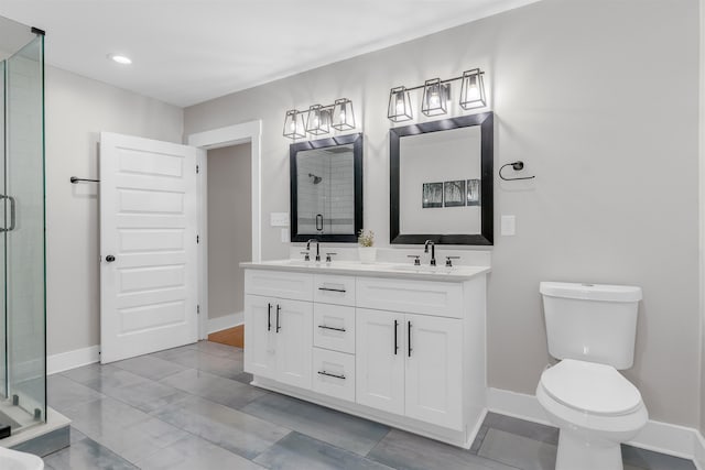 185 Alexander St, Memphis, TN 38111 - full bath featuring a shower stall, baseboards, toilet, double vanity, and recessed lighting