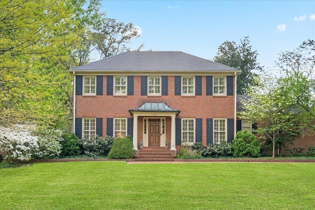 105 Grove Park Cir, Memphis, TN 38117 - view of front of house with a front yard and brick siding