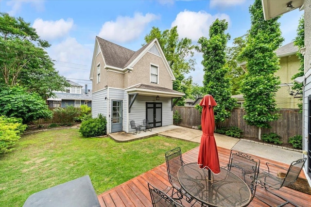 1751 Carr Ave, Memphis, TN 38104 - back of house featuring a patio, a wooden deck, outdoor dining space, and a shingled roof