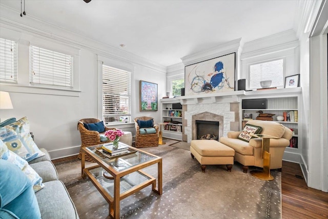 1751 Carr Ave, Memphis, TN 38104 - living area with crown molding, a fireplace, baseboards, wood finished floors, and built in features