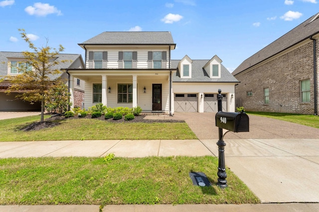 940 Cypress Vine Cv, Collierville, TN 38017 - traditional-style home with concrete driveway, an attached garage, a front lawn, and a porch