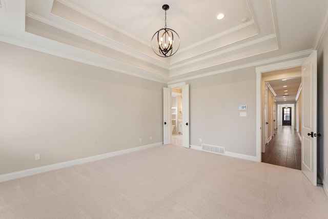 940 Cypress Vine Cv, Collierville, TN 38017 - empty room with a chandelier, a raised ceiling, carpet floors, ornamental molding, and recessed lighting