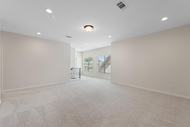 940 Cypress Vine Cv, Collierville, TN 38017 - spare room featuring light colored carpet, baseboards, and recessed lighting