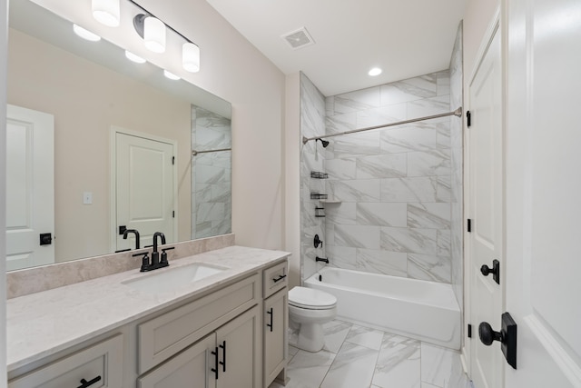 940 Cypress Vine Cv, Collierville, TN 38017 - bathroom featuring marble look tiles, toilet, vanity, shower / tub combination, and recessed lighting