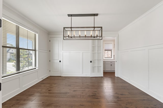 940 Cypress Vine Cv, Collierville, TN 38017 - unfurnished dining area with a decorative wall, a chandelier, crown molding, healthy amount of natural light, and a wainscoted wall