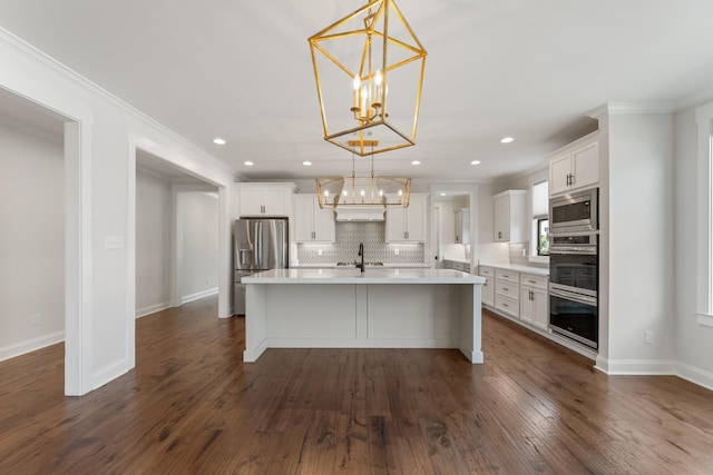 940 Cypress Vine Cv, Collierville, TN 38017 - kitchen with stainless steel appliances, a chandelier, white cabinetry, recessed lighting, and crown molding