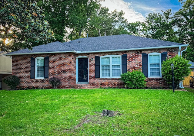 4486 Mayo Ave, Memphis, TN 38128 - ranch-style house with roof with shingles, a front lawn, and brick siding