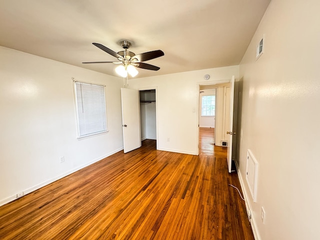 4486 Mayo Ave, Memphis, TN 38128 - unfurnished bedroom featuring wood finished floors, a closet, baseboards, and a ceiling fan
