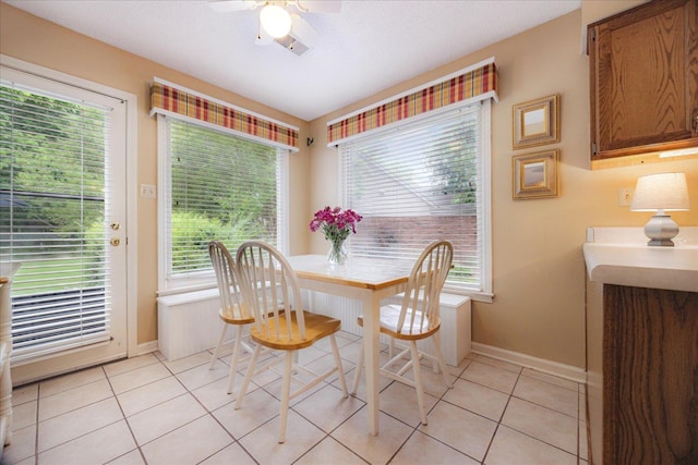8570 W Park Trail Dr, Germantown, TN 38139 - dining space with baseboards, a ceiling fan, and light tile patterned flooring