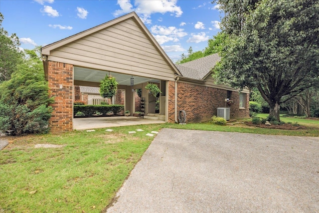 8570 W Park Trail Dr, Germantown, TN 38139 - ranch-style house with brick siding, cooling unit, and a front lawn