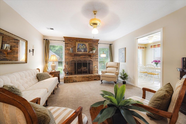 8570 W Park Trail Dr, Germantown, TN 38139 - carpeted living room with a ceiling fan, a brick fireplace, and plenty of natural light
