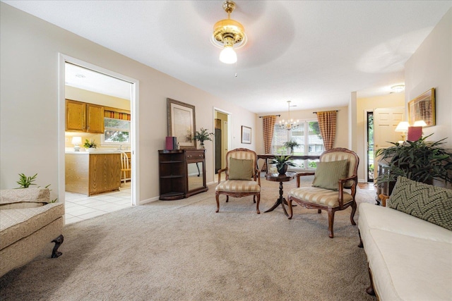 8570 W Park Trail Dr, Germantown, TN 38139 - living area featuring light colored carpet, a chandelier, and ceiling fan