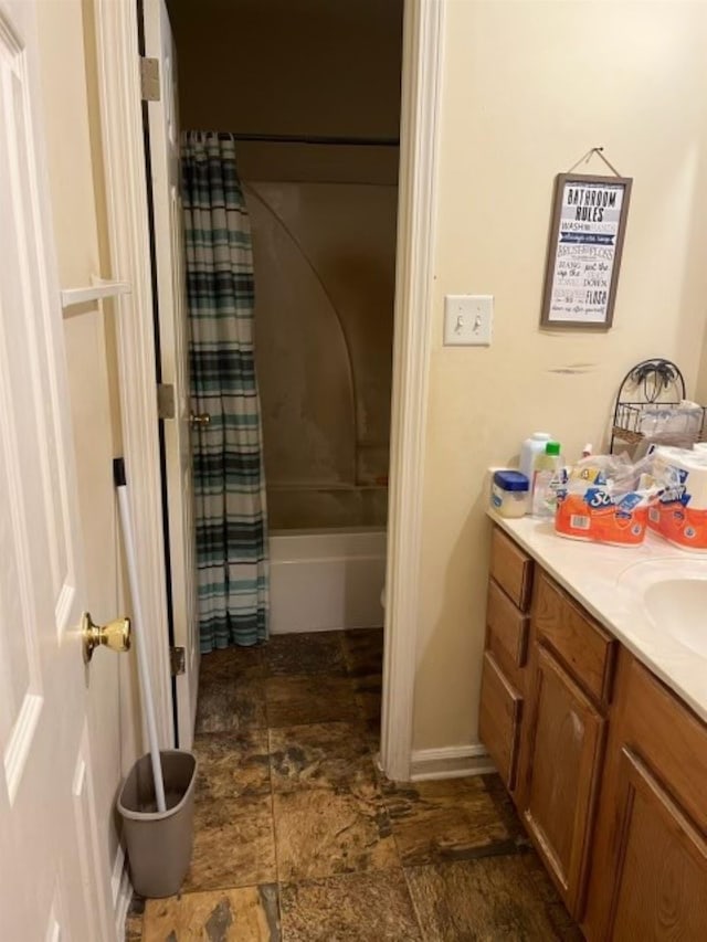 2583 Faxon Ave, Memphis, TN 38112 - full bath with stone finish flooring, vanity, and shower / tub combo with curtain