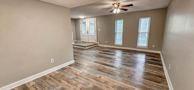 1731 Hobbits Glen Dr Unit 14, Germantown, TN 38138 - unfurnished room featuring wood finished floors, a ceiling fan, and baseboards