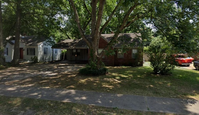 4405 Boyce Rd, Memphis, TN 38117 - view of front of property featuring concrete driveway, a carport, and a front lawn