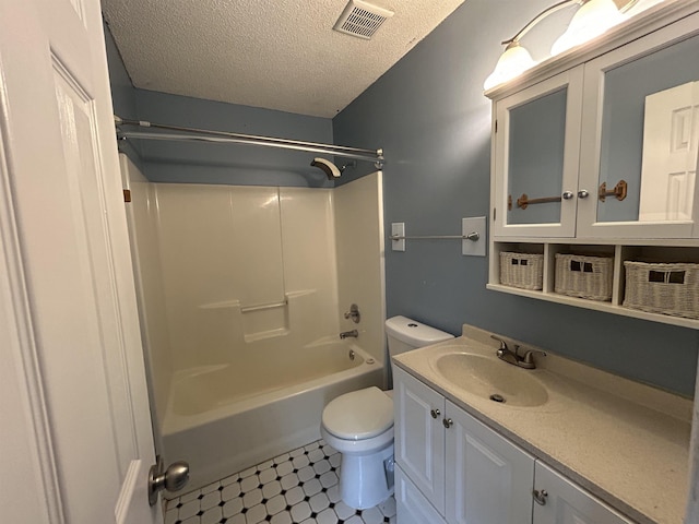 6823 Northknoll Ave, Millington, TN 38053 - bathroom featuring a textured ceiling, toilet, vanity, and bathing tub / shower combination