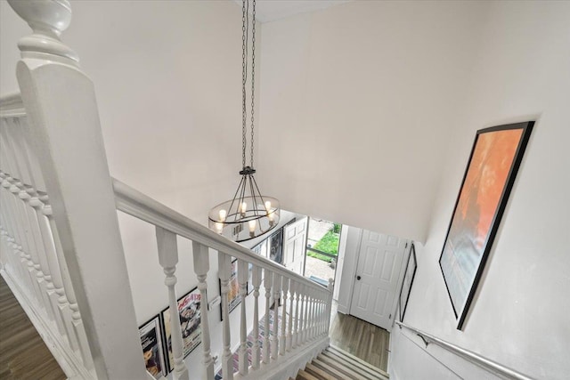 2268 Tunis Cv Unit 2268, Memphis, TN 38104 - staircase featuring a chandelier, wood finished floors, and a towering ceiling