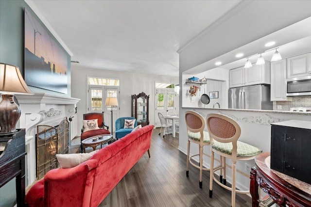 2268 Tunis Cv Unit 2268, Memphis, TN 38104 - living area featuring a lit fireplace, recessed lighting, dark wood-style floors, and ornamental molding