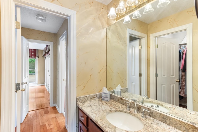 7475 Willey Rd, Germantown, TN 38138 - bathroom with wood finished floors, vanity, and a textured ceiling