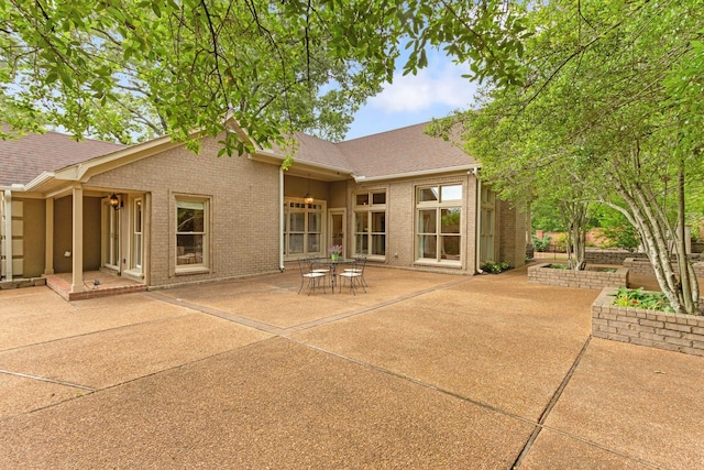 7475 Willey Rd, Germantown, TN 38138 - rear view of property with a patio, brick siding, and a shingled roof