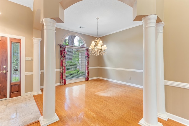 7475 Willey Rd, Germantown, TN 38138 - entryway with crown molding, wood finished floors, and baseboards