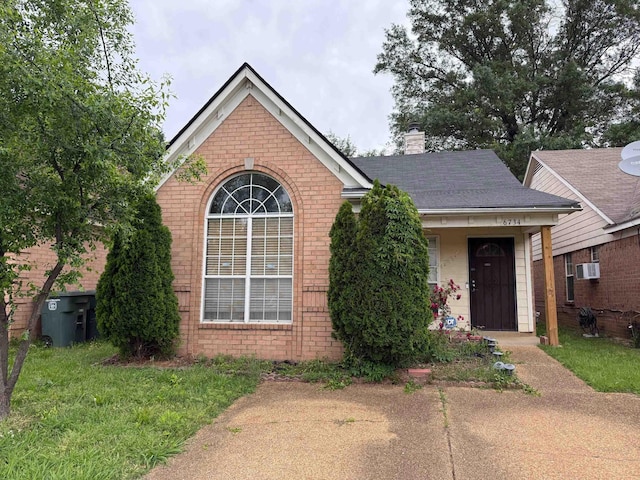6734 N Regency Park Cir, Memphis, TN 38115 - view of front of property with brick siding and a chimney
