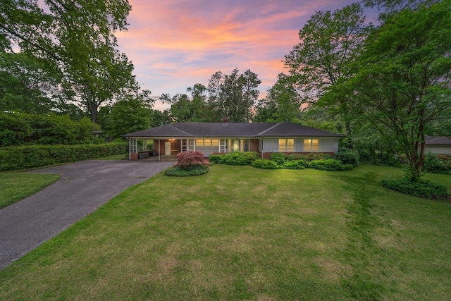 4539 Kings Park Rd, Memphis, TN 38117 - ranch-style house featuring asphalt driveway, a carport, and a front yard