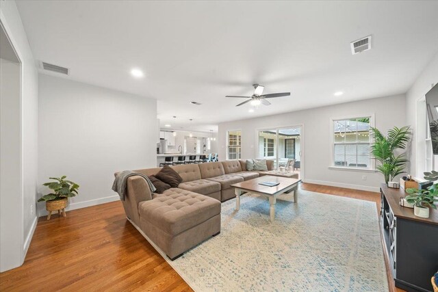 4539 Kings Park Rd, Memphis, TN 38117 - living area with baseboards, wood finished floors, ceiling fan, and recessed lighting
