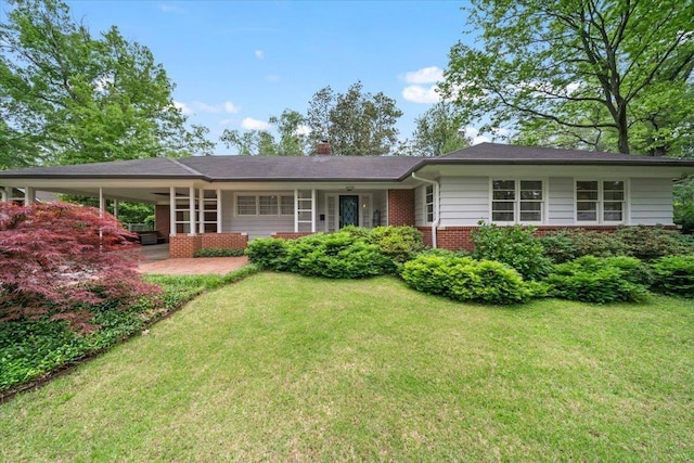 4539 Kings Park Rd, Memphis, TN 38117 - ranch-style home with brick siding, a front yard, an attached carport, and a chimney