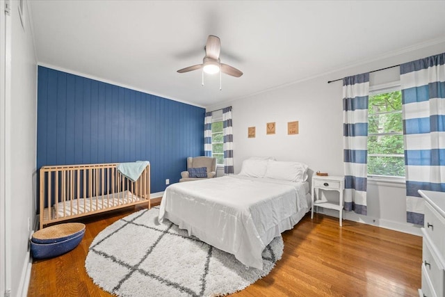 4539 Kings Park Rd, Memphis, TN 38117 - bedroom with wood finished floors, crown molding, a ceiling fan, and baseboards