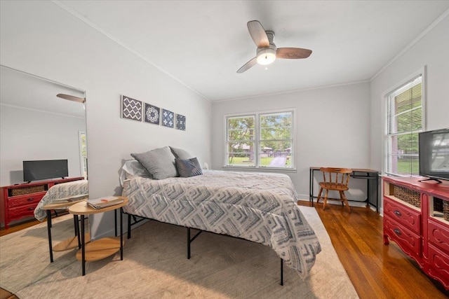 4539 Kings Park Rd, Memphis, TN 38117 - bedroom with ornamental molding, wood finished floors, multiple windows, and a ceiling fan