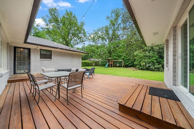 4539 Kings Park Rd, Memphis, TN 38117 - deck featuring outdoor dining area, a playground, and a yard