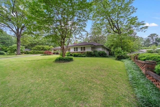 4539 Kings Park Rd, Memphis, TN 38117 - view of front facade with a front lawn and a chimney