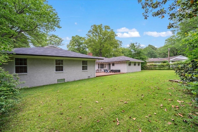 4539 Kings Park Rd, Memphis, TN 38117 - rear view of property with brick siding, a yard, a chimney, and a patio area