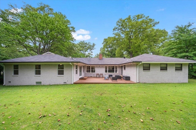 4539 Kings Park Rd, Memphis, TN 38117 - back of house with brick siding, a yard, a wooden deck, a chimney, and an outdoor living space