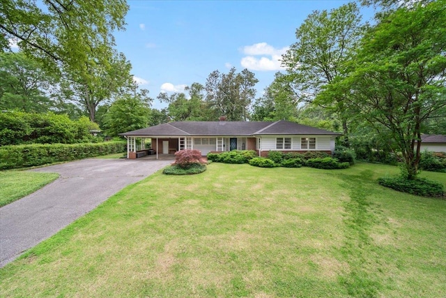 4539 Kings Park Rd, Memphis, TN 38117 - ranch-style house with driveway, a carport, a front lawn, and a chimney