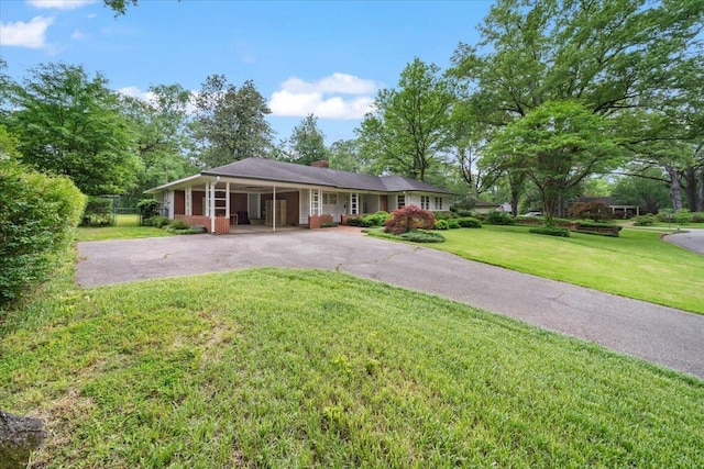 4539 Kings Park Rd, Memphis, TN 38117 - ranch-style house featuring driveway, a chimney, and an attached carport