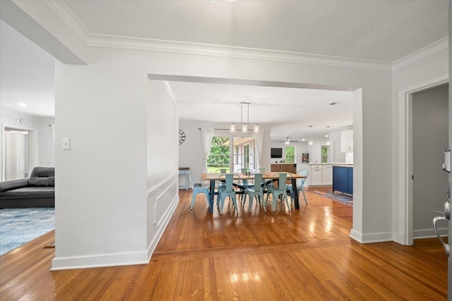 4539 Kings Park Rd, Memphis, TN 38117 - dining area featuring light wood-style flooring, ornamental molding, and baseboards