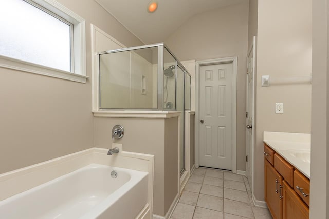 bathroom with a shower stall, tile patterned floors, vanity, a bath, and lofted ceiling