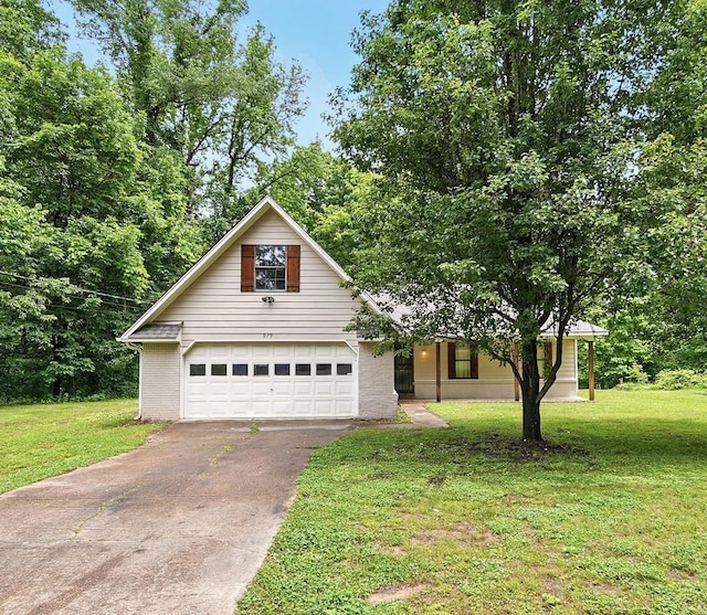 979 Ray Bluff Rd, Millington, TN 38053 - view of front of home with driveway, a garage, and a front lawn